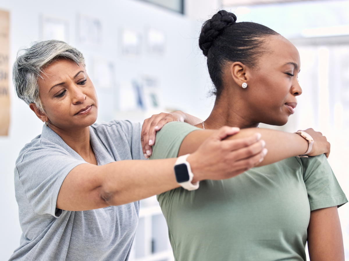 A woman receiving physical therapy for her shoulder impingement.