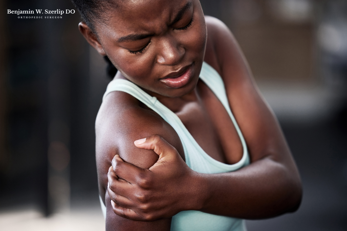 A woman experiencing severe shoulder pain caused by a fall that fractured her shoulder in Austin, Texas.