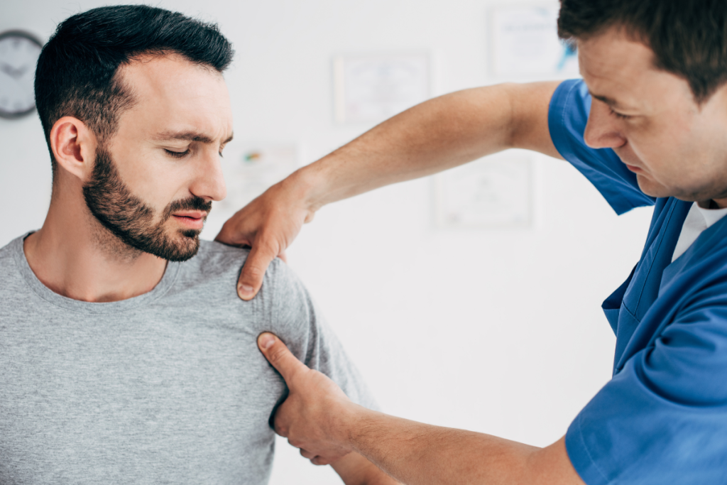A doctor examining a patient with rotator cuff issues in Texas.