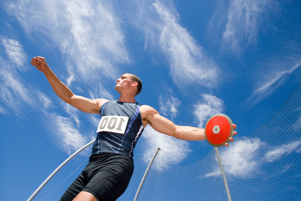 An athlete throwing a discus in Texas.