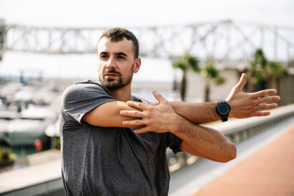 A man stretching his arm after recovering from Shoulder Replacement Surgery in Texas.