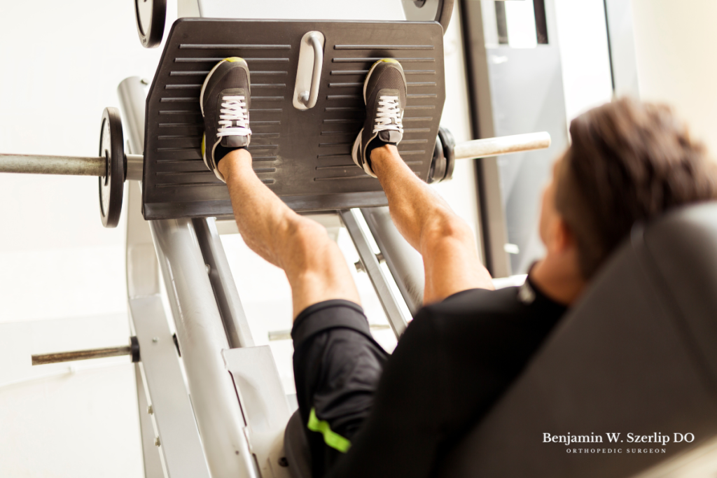 A man doing leg presses to restore strength in his legs as he recovers from a tibial plateau fracture in Texas.